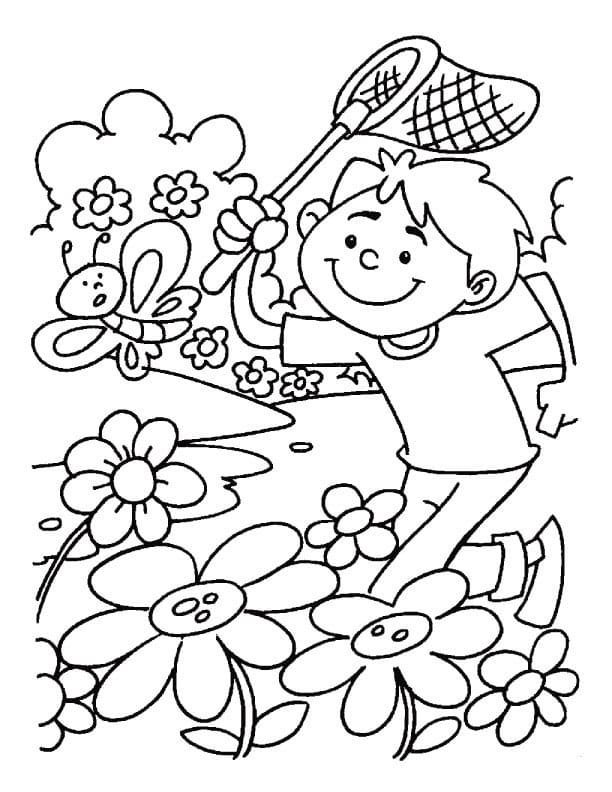 Мальчик бегает по ромашковому полю и ловит бабочек.