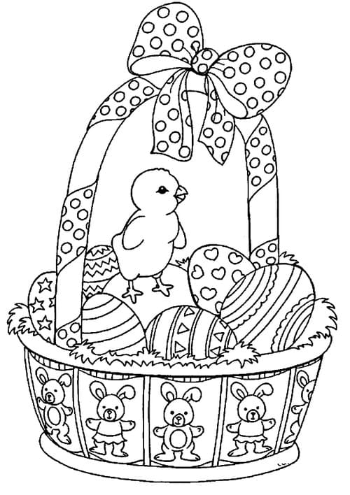 Птенец и корзинка с пасхальными яйцами.