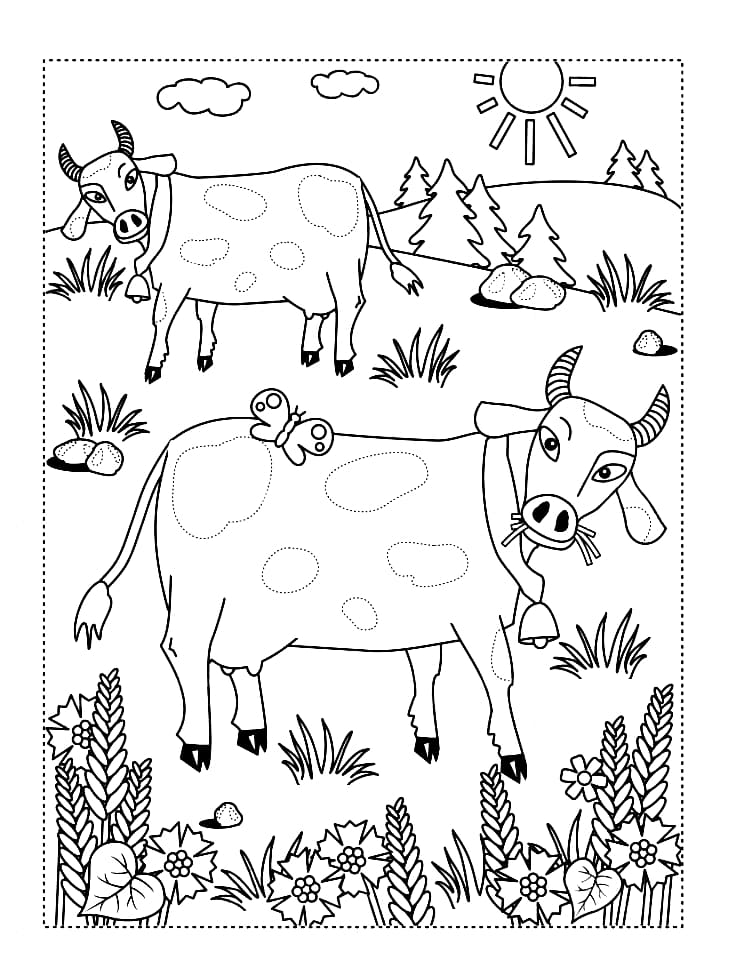 Две красивых коровы кушают траву